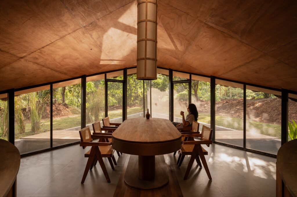 Interior dining space with views out to the forest