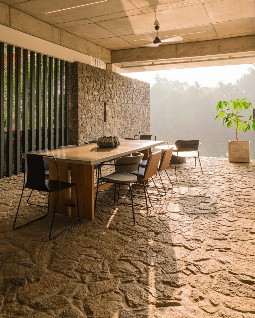 The dining patio, paved in stone, looks out to the river. Photo: Praveen Mohandas
