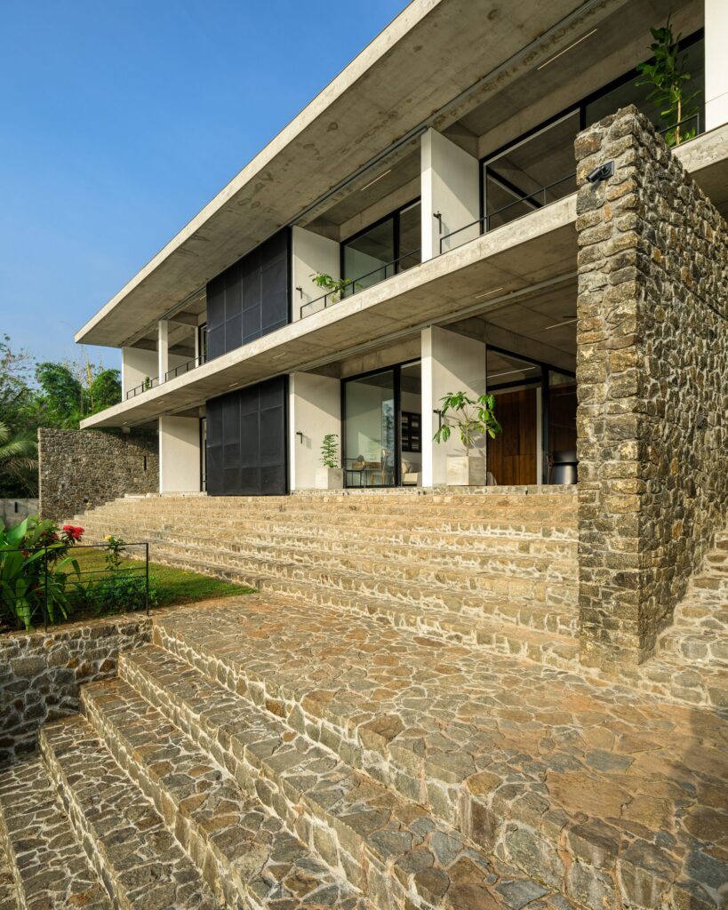 Stone steps lead down from the house to the riverfront yard. Photo: Praveen Mohandas