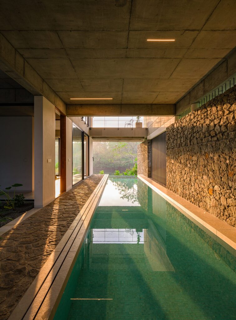 The lap pool runs along a stone wall. Photo: Praveen Mohandas