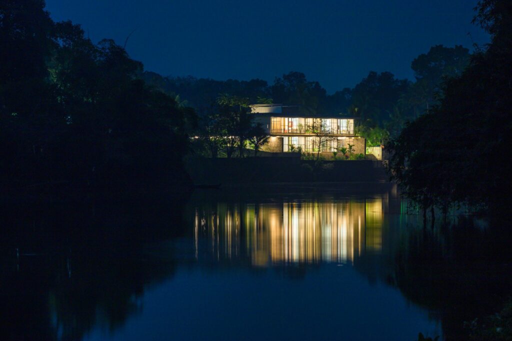 The house at dusk, reflected in the river. Photo: Praveen Mohandas